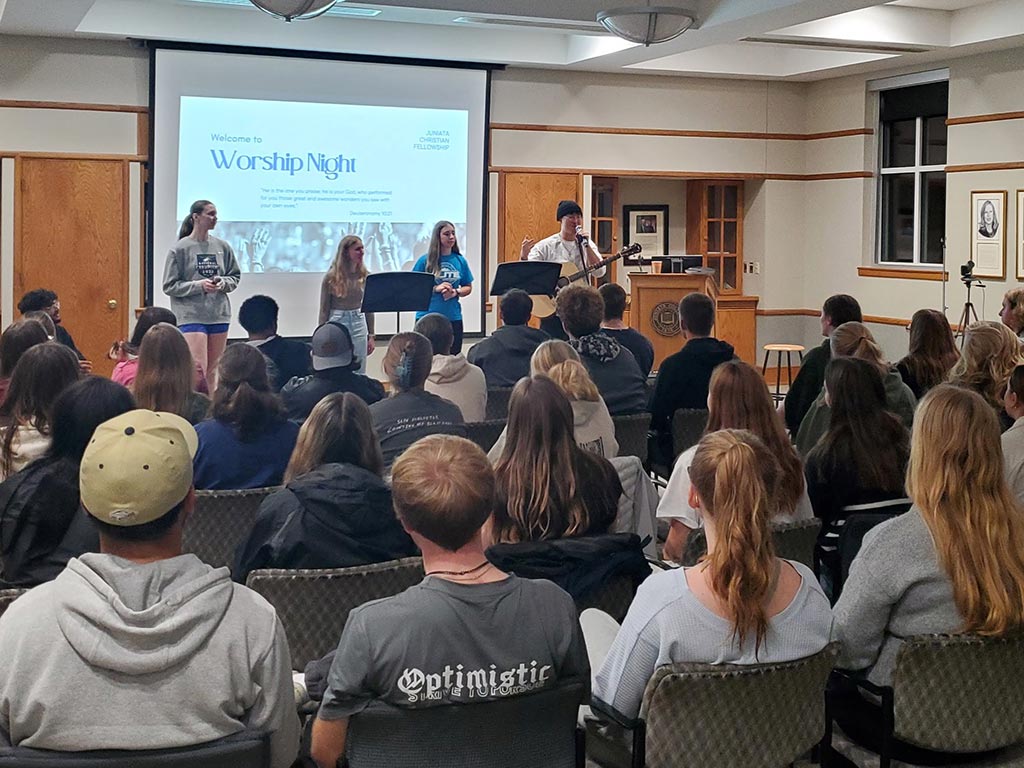 photo of students at a gathering playing music
